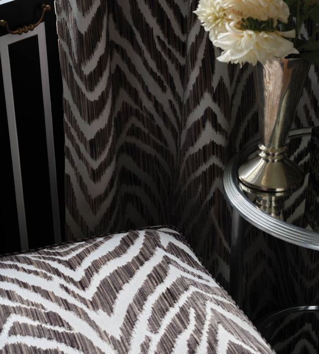 Zebra Strie velvet animal print fabric by Travers on a statement chair