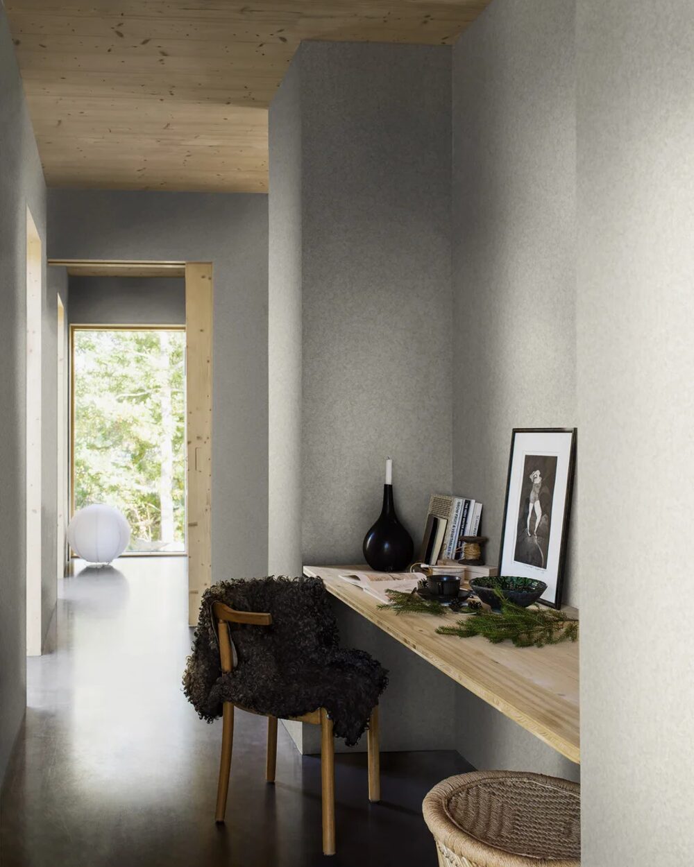 Boråstapeter Northern Stone wallpaper in a calm grey hallway study nook